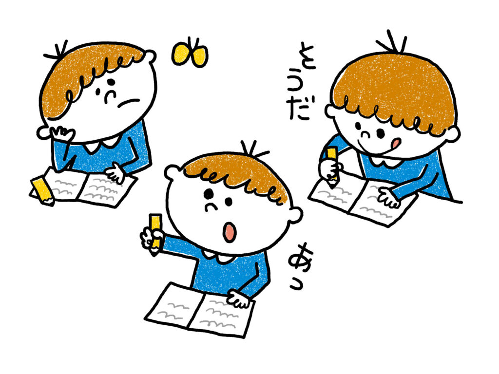 楽しそうに一人で勉強をする男の子